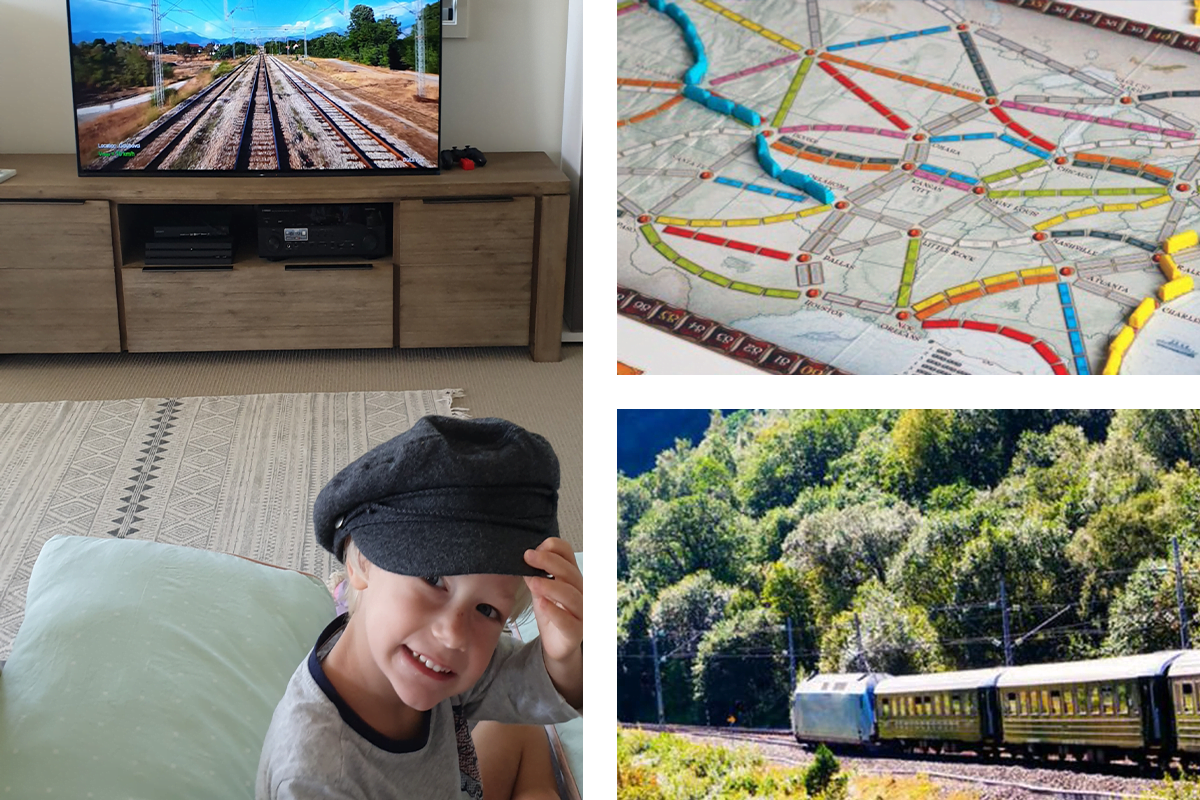 child playing trains in front of tv